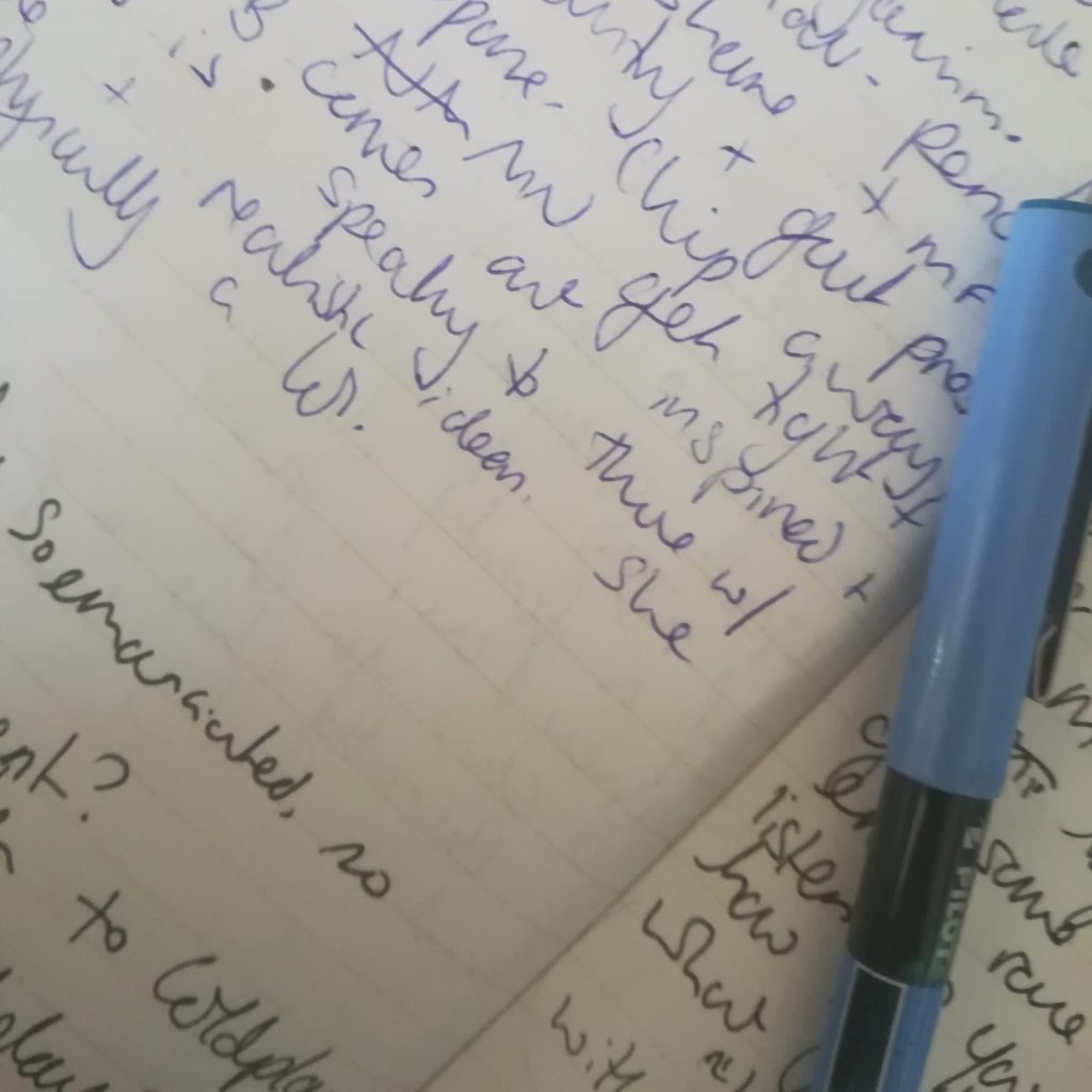 handwriting and a pen