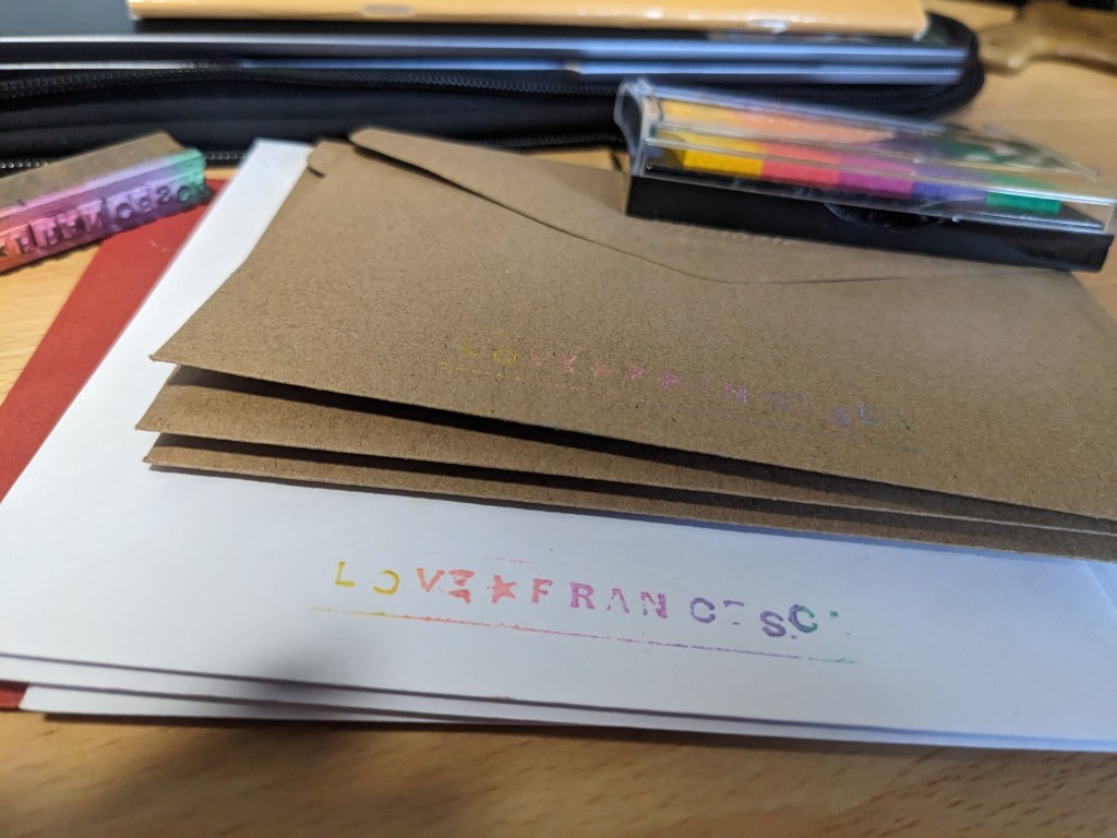 stack of envelopes and colourful stamps reading 'Love Francesca'